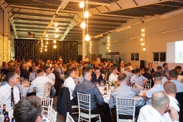 Guests seated at round tables during Pendennis’ 2021 Apprentice Graduation. The event was held in our Hospitality Suite at our Falmouth headquarters