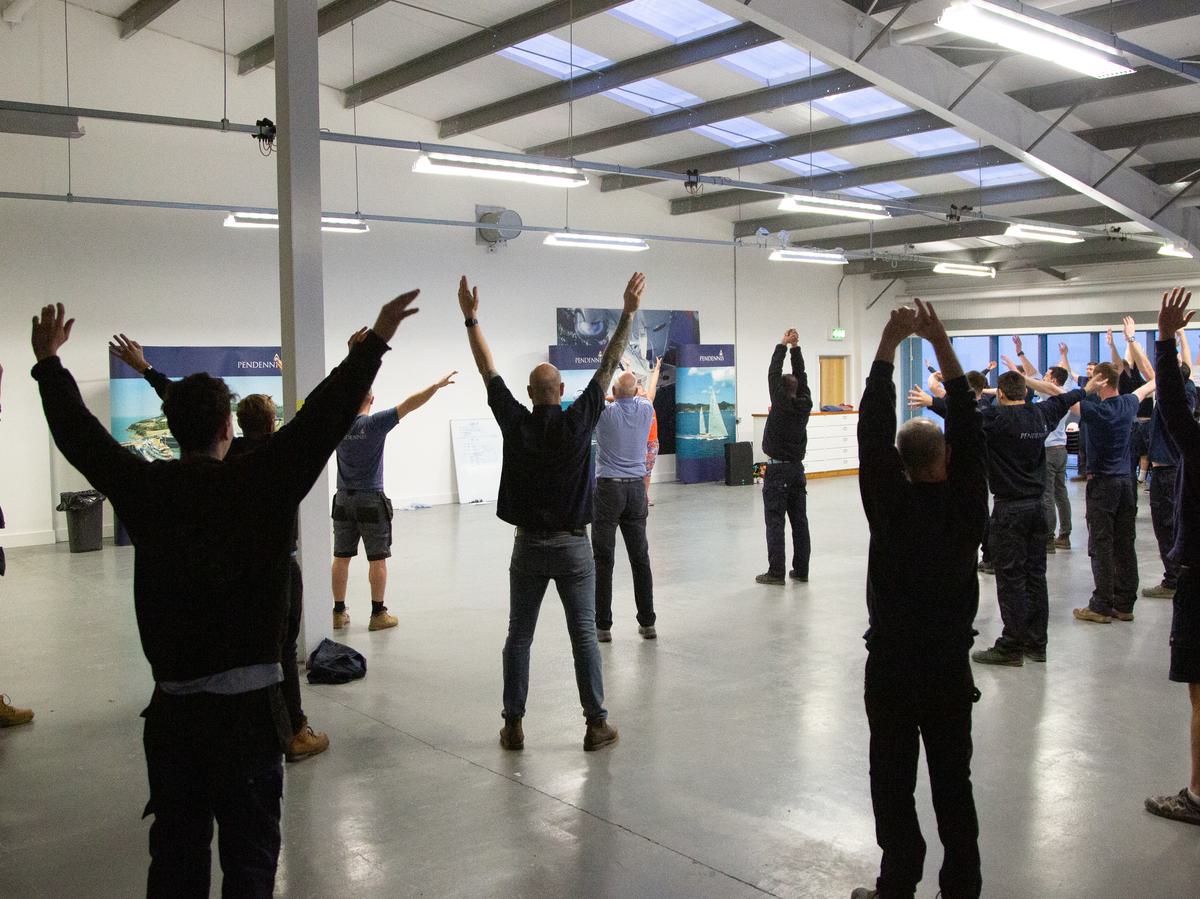 Pendennis employees take part in a morning stretch class