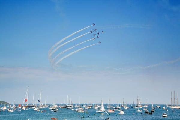 The Red Arrows perform an aerial display over a crowded Falmouth Bay during the 2014 Pendennis Cup.