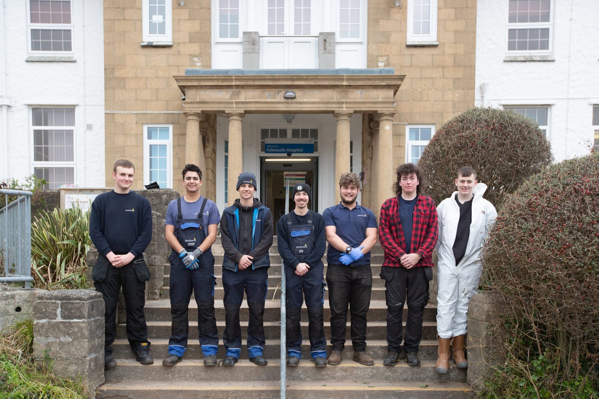 Pendennis apprentices standing outside Falmouth Hospital after taking part in community gardening during Community Week 2023.