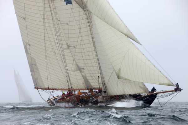 Classic schooner Mariette under full sail cutting through waves during the 2012 Pendennis Cup.
