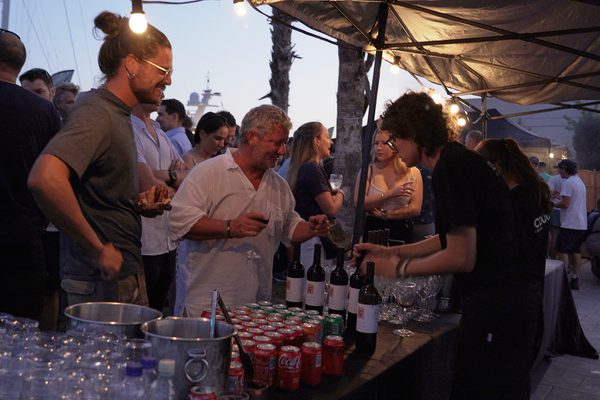 Guests enjoying food and drinks at a Pendennis-hosted barbecue during the America’s Cup Preliminary Regatta.
