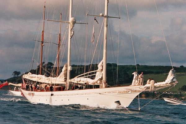 Classic schooner Adela under sail with crew on deck, seen off the coast of Falmouth after her launch.