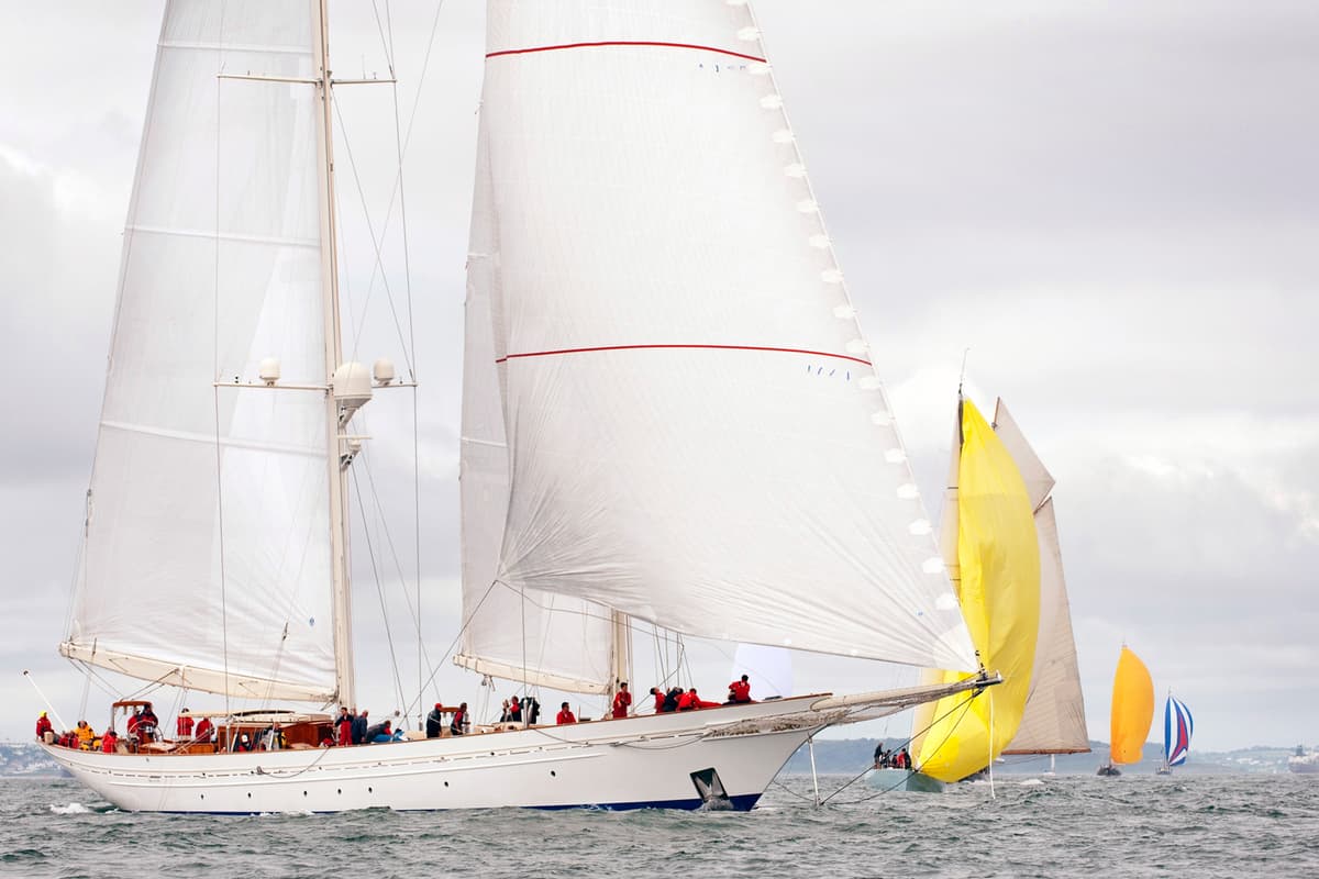 Sailing yacht Adela leading a fleet of classic yachts during the 2012 Pendennis Cup, following her extensive restoration at Pendennis.
