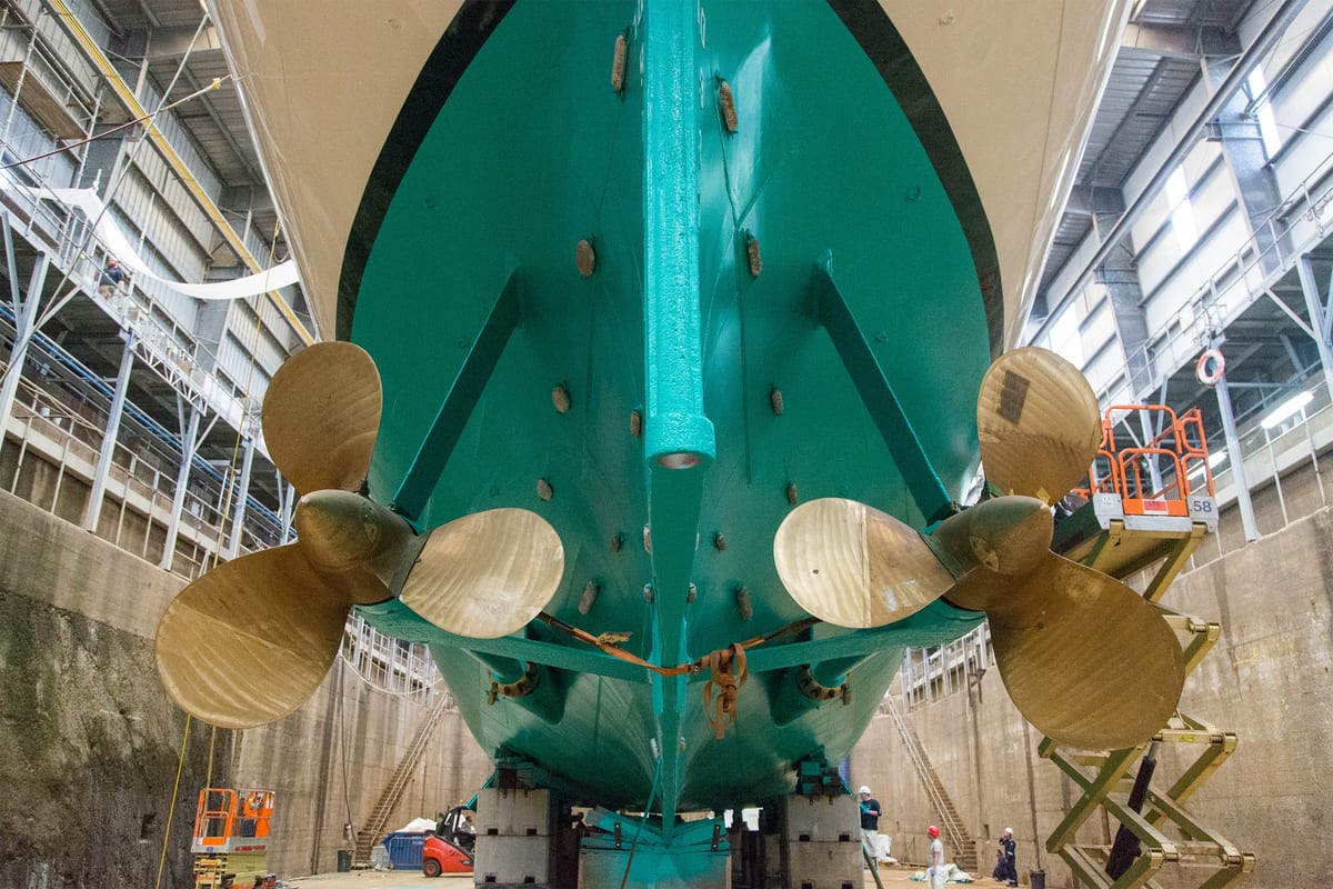Haida 1929 in dry dock showing freshly painted hull and twin bronze propellers during restoration.