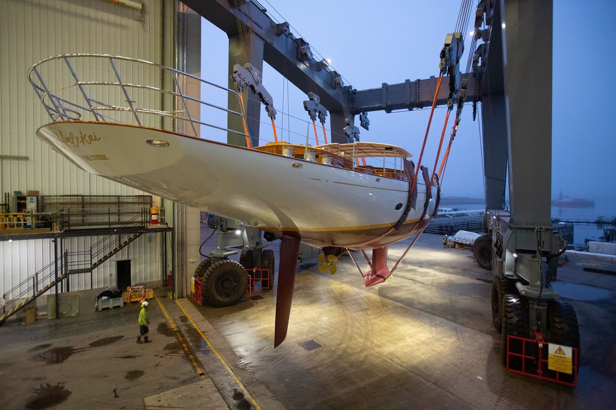 Halekai suspended in slings during early morning launch at Pendennis Shipyard.