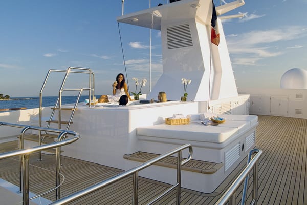 Guests relaxing in the newly installed jacuzzi on Illusion’s sundeck following Pendennis’s 2010 refit.