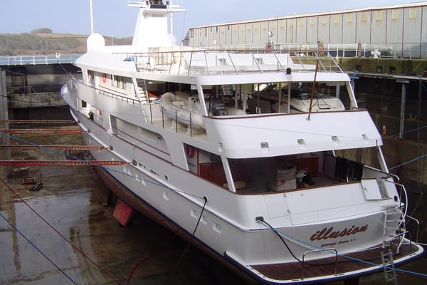 Superyacht Illusion in dry dock at Pendennis during refit preparations.