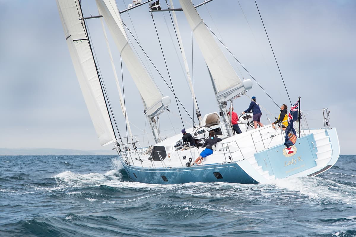 Crew sailing Lady K during sea trials after her 6-month refit, with sails fully raised on open water.