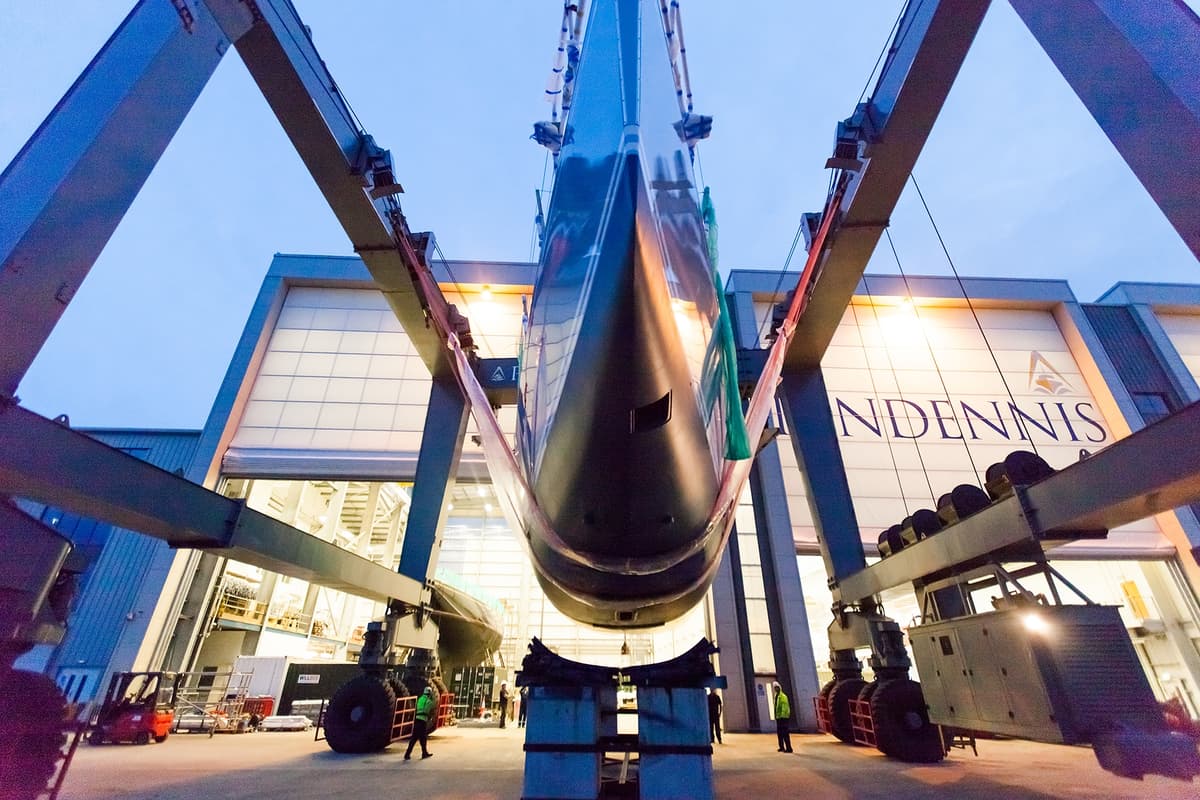 Lady K being transported from Pendennis Hall 1 to the wet basin by travel hoist during twilight.