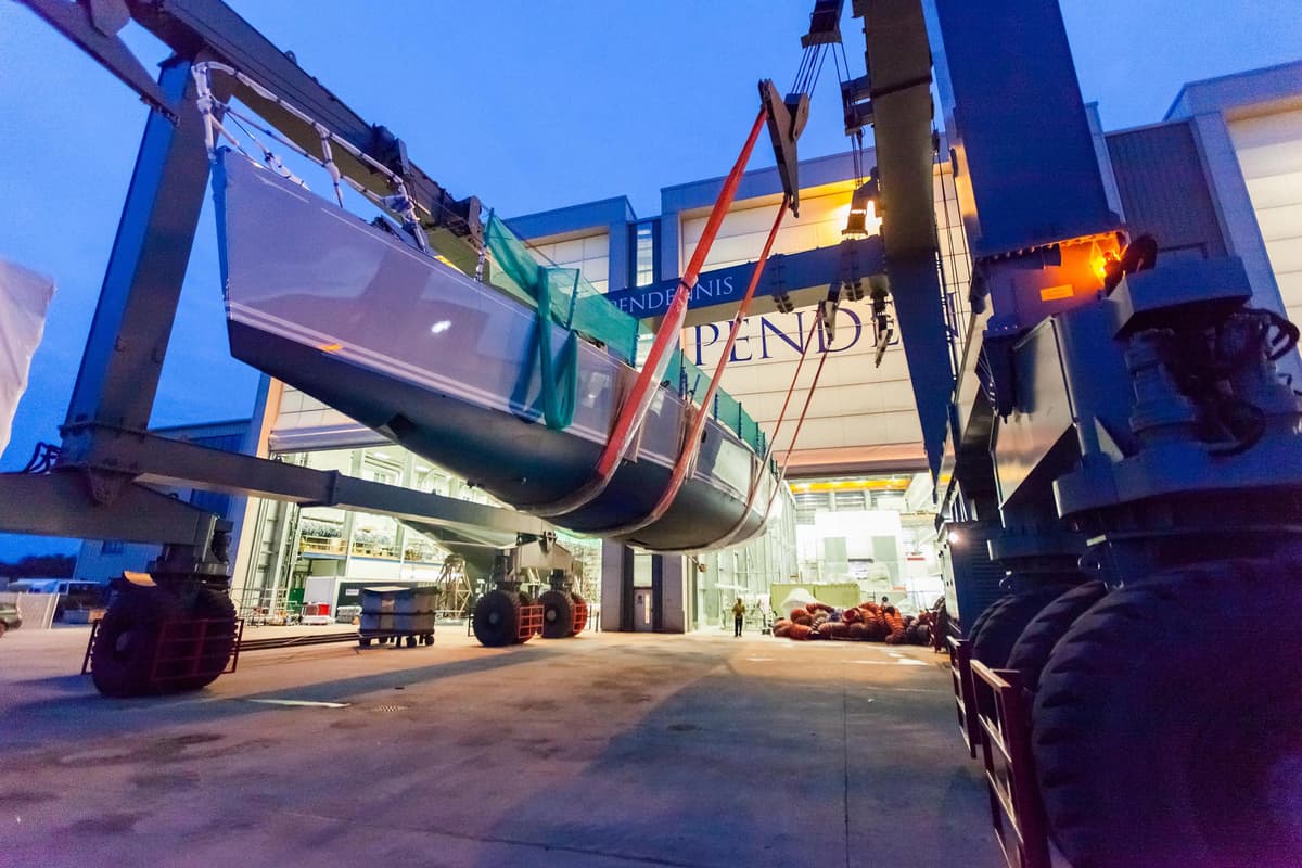 Lady K suspended in a travel hoist during her relaunch at Pendennis after refit work.