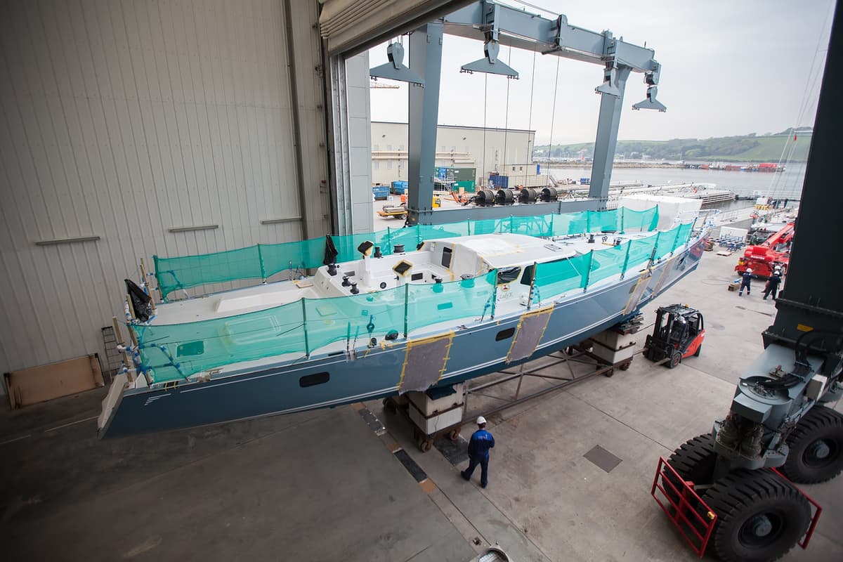 Lady K positioned in Pendennis’s 640-tonne travel hoist, leaving Hall 1 during her refit process.