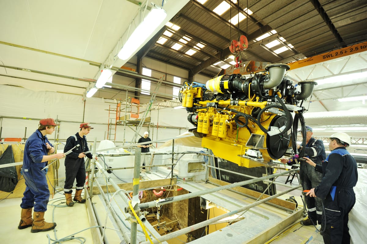 Engineers install a new Caterpillar engine during M5’s major engineering upgrade and 10-year DNV survey.
