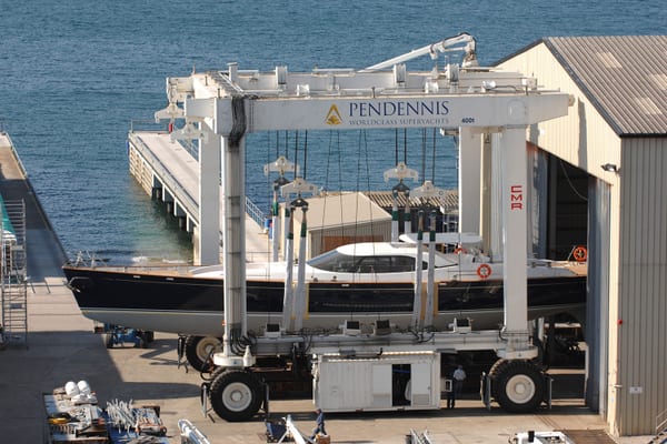 Nostromo being rolled out of Pendennis's main shed in the 400-tonne travel hoist after build completion.