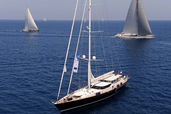 Tenaz under sail at the 2013 Dubois Cup, surrounded by other superyachts on open water.