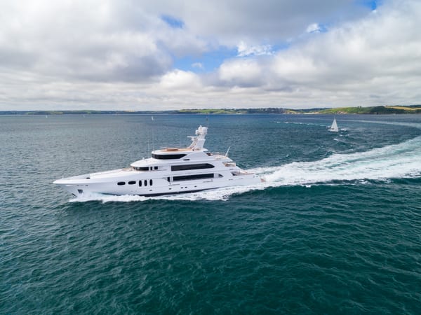 Whitestar underway at speed in Falmouth Bay during post-refit sea trials, leaving a sweeping trail behind.