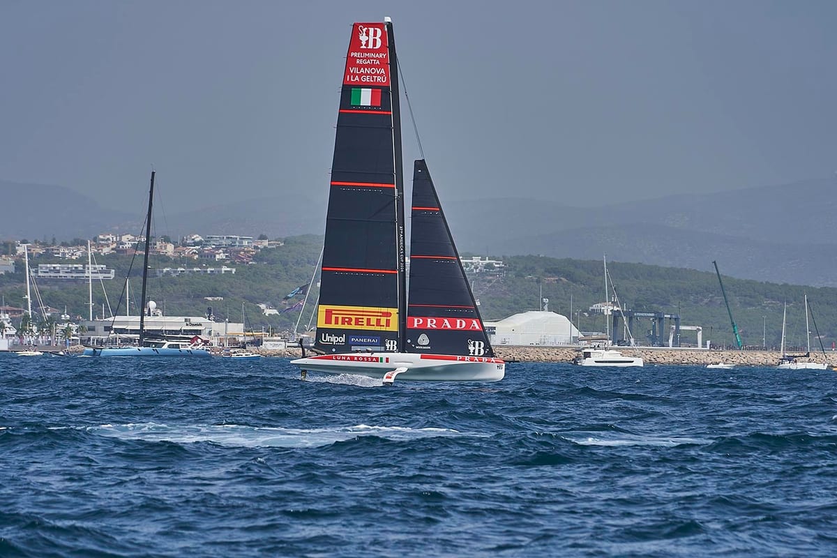 Luna Rossa Prada Pirelli racing yacht sails past the coastline during the first preliminary regatta of the 37th America's Cup near Pendennis Vilanova.