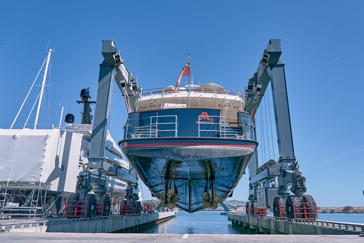 Stern end of a motor yacht hauled out of the water