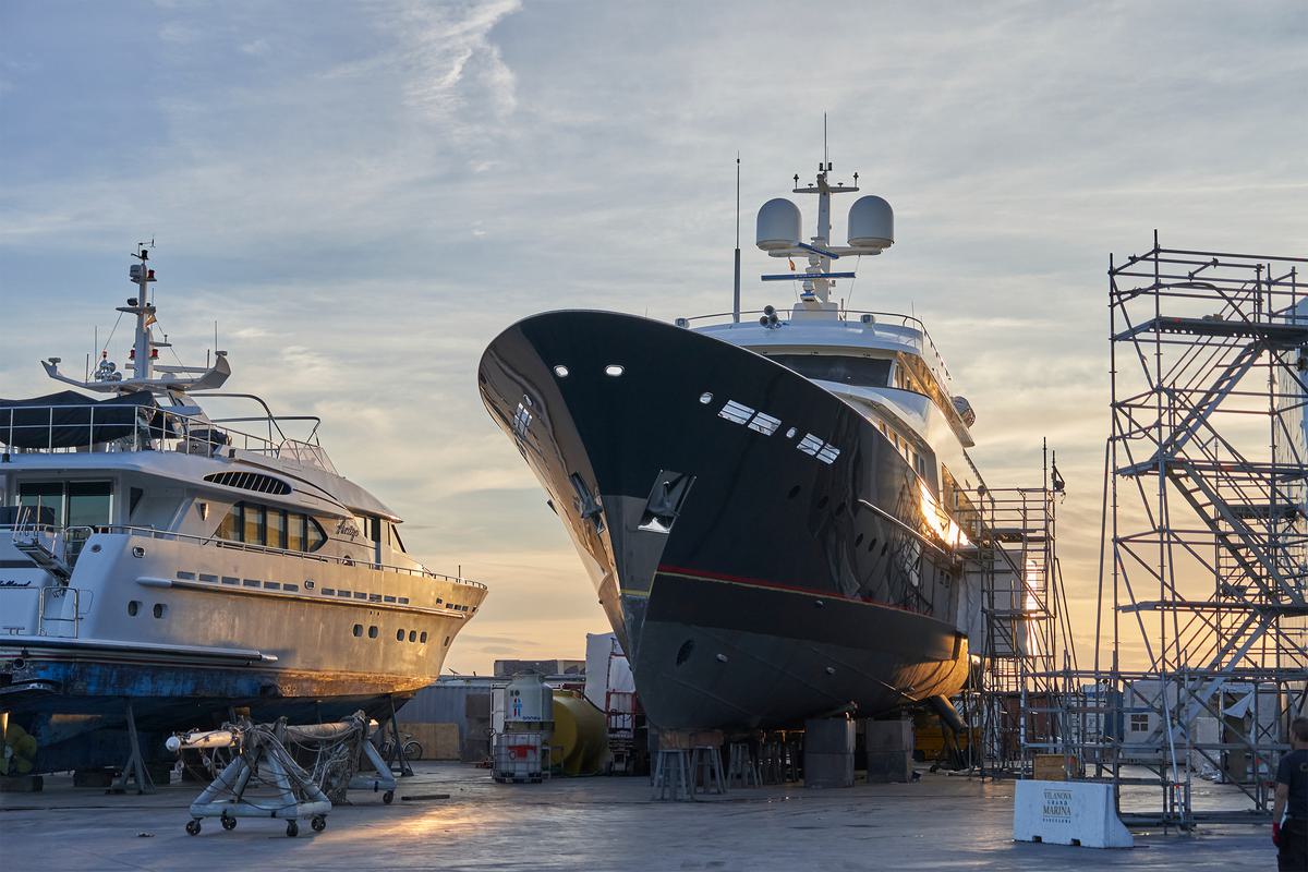 A motor yacht on the hard standing at sunset