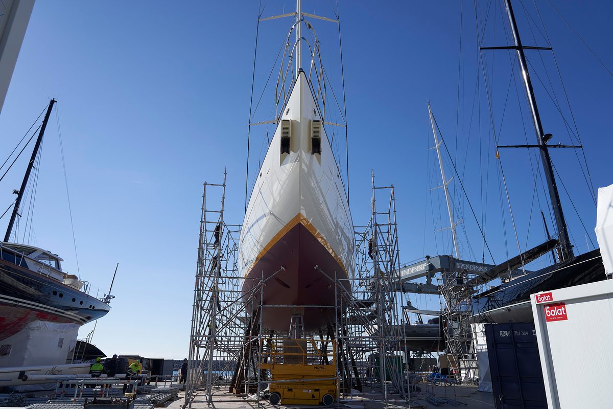 Halekai in the yard at Pendennis Vilanova, scaffolded and undergoing refit work under clear blue skies.