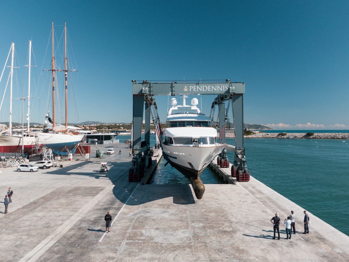 Superyacht being hauled out by Pendennis Vilanova’s 620t travel hoist on the 30,000sqm hardstanding.